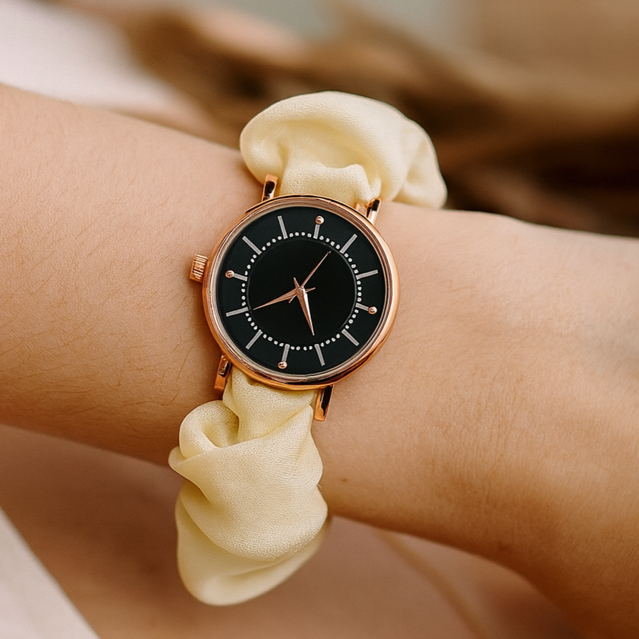 UGC-style photo of cream scrunchie watch with black dial
