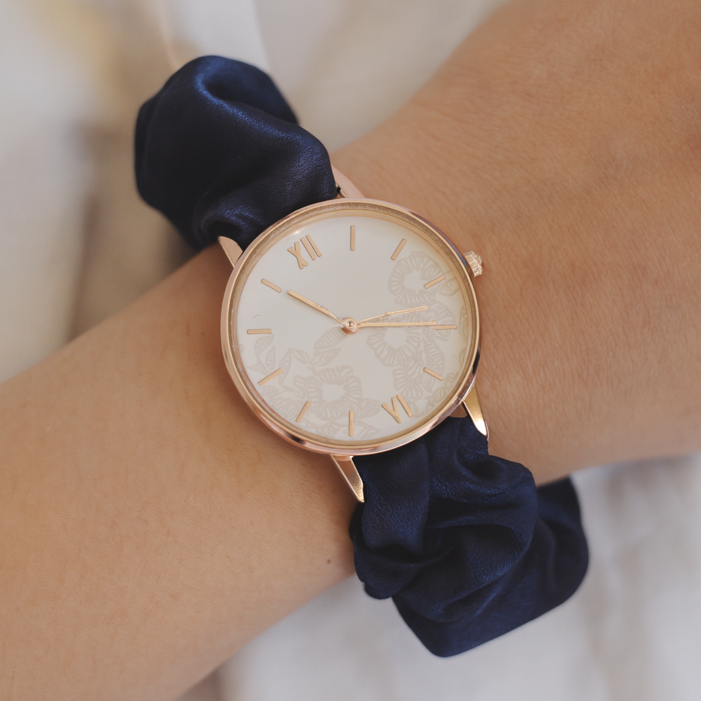 UGC style photo of watch with navy blue shimmer band