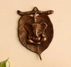 Divine Blessings – Metal Wall Hanging of Lord Ganesha on Leaf